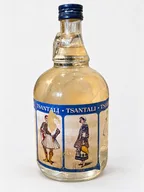 Tsantali costume-label bottle — probable ouzo (B0030)